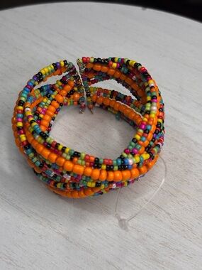 Multicolor Seed Bead Coil Bracelet with Bright Orange Accent